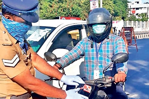 Police affixing stickers on vehicles of government staff, doctors, bank staff and journos