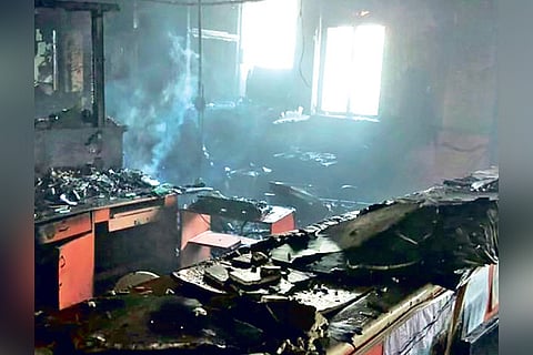 The charred remains of computers and office files at LIC office at Parry?s Corner on Tuesday