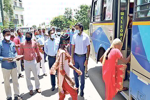 Tirupur District Collector K Vijayakarthikeyan (right) looks on as rescued minors leave for hometown