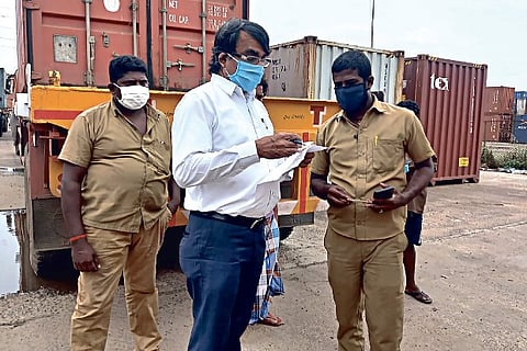 Officials oversee the operation at a CFS in Manali on Sunday