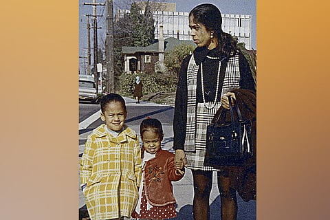 Harris (L) with her sister Maya and mother Shyamala in California