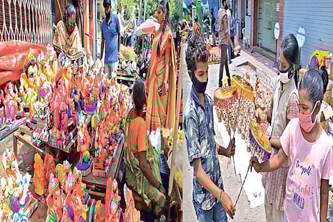 Vendors arrange idols as they wait for customers on the eve of Vinayaga Chathurthi at Mylapore