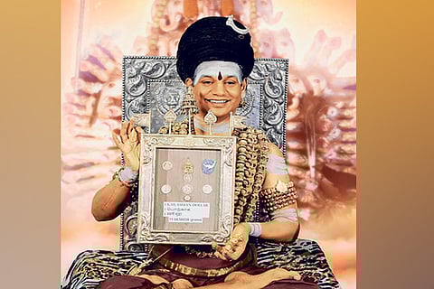 Nithyananda unveiling the currency on his FB page