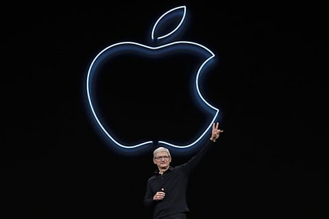 Apple CEO Tim Cook waves after speaking at the Apple Worldwide Developers Conference in San Jose