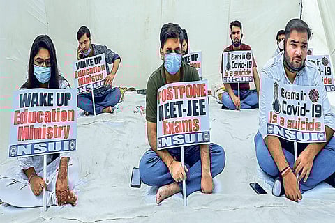 NSUI members display placards during a hunger strike in protest against Centre?s decision