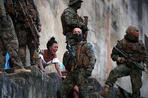 A picture and its story: The despair of a Rio widow, in a city struggling with violence