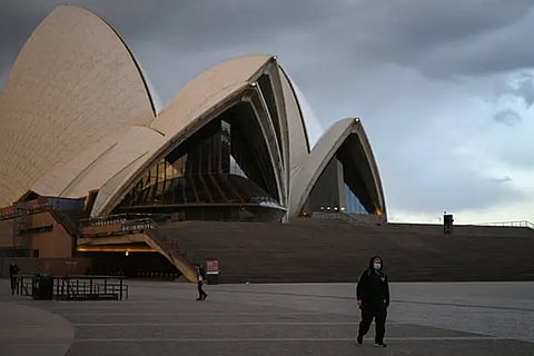 A rise in coronavirus cases has put the plan on hold. Above, a scene outside the Sydney Opera House