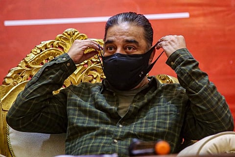 MNM Chief Kamal Haasan wears a mask during a meeting with party officials ahead of Assembly Election