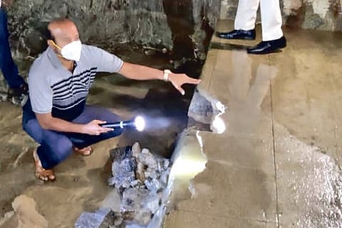 Vellore Collector Shanmuga Sundaram inspecting the breach (circled) in Nellorepet Lake on Tuesday