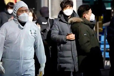 South Korea's Moon under fire for vaccine plans as COVID-19 cases surge