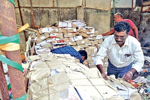 A view of the bundles of textbooks kept at the scrap shop in Mayiladuthurai on Tuesday.