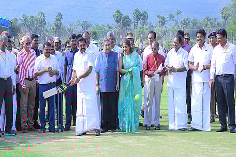 Chief Minister Edappadi K Palaniswami hitting a ball bowled by ace cricketer Rahul Dravid in Salem on Sunday