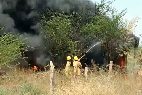Fire fighters in action at Chokkanathanpatti on Monday