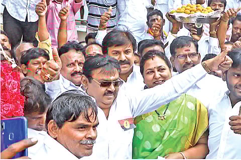 DMDK founder Vijayakant showing thumbs-up sign to party workers in Chennai on Wednesday