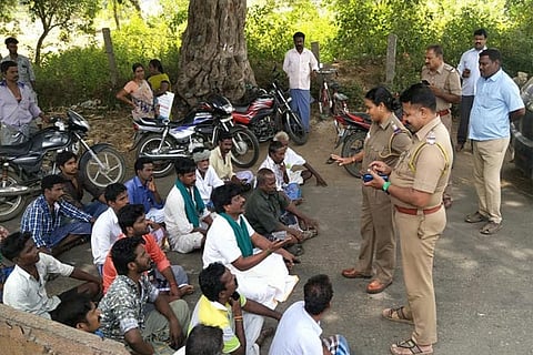 Farmers block a road in Tiruchy on Thursday