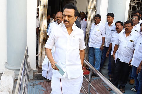 DMK MLAs, led by party president MK Stalin, walking out of the Assembly on Monday