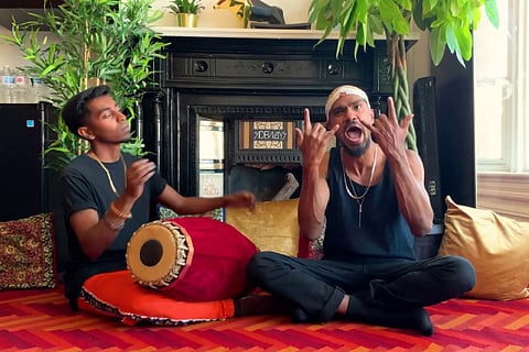 Yanchan Rajmohan (left) plays mridangam while Shan raps