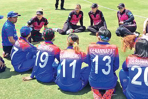 New Zealand and Thailand teams engage in conversation after the match