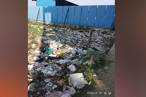 With no garbage bins in the locality, residents dump waste on empty plots