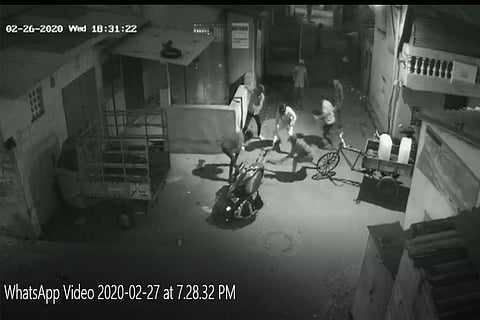 Video grab of the gang surrounding and hacking Diwakar