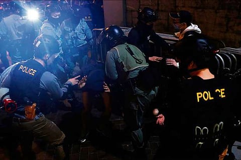 China removes top Hong Kong official after pro-democracy protests