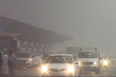 Heavy fog blanket near city airport