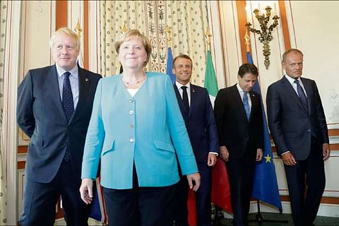 Merkel, Macron, Johnson urge Iran not to flout nuclear deal