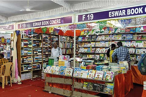 Visitors browse books at the fair organised by BAPASI held at YMCA grounds in Nandanam, on Friday