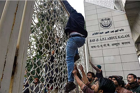 Jamia Milia Islamia University students protest demanding registration of an FIR against police