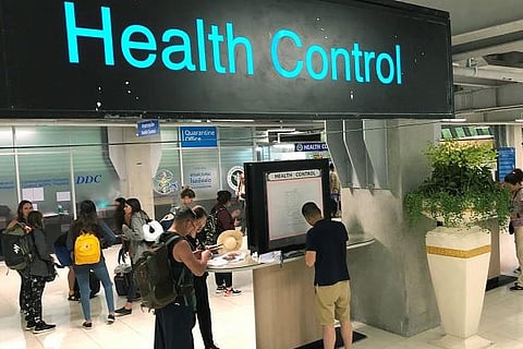 Tourist line-up in a health control at Suvarnabhumi international airport in Bangkok. Photo: Reuters