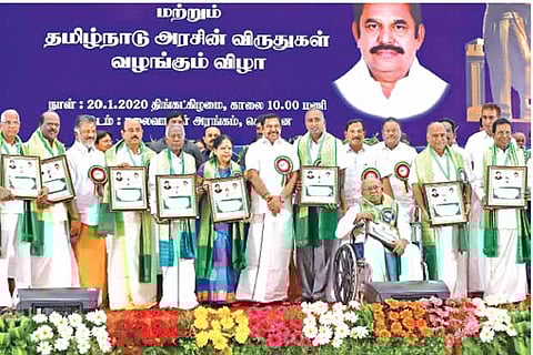 Tamil scholars, who were honoured, pose with Chief Minister Edappadi K Palaniswami and Dy CM O Panneerselvam