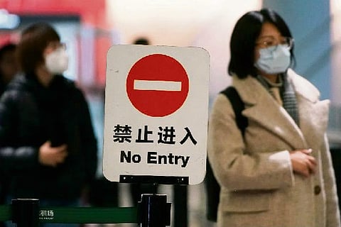 China suspends all public transport in Wuhan city as coronavirus cases climb to 571 with 17 deaths