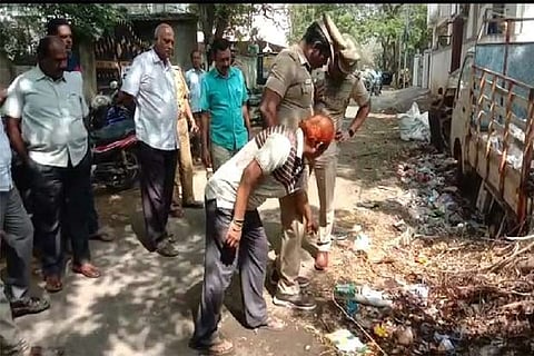 Forensic team and police officers inspecting the site of blast