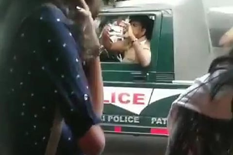 A cop was seen filming a protest in this viral video