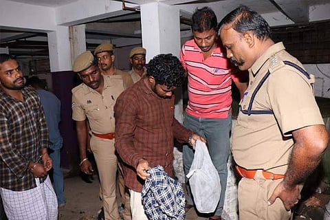 Thoufeeq showing clothes worn by him during the crime before the investigation team at Vatakara in Kerala