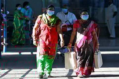 People wearing masks coming out of Chennai international airport on Thursday