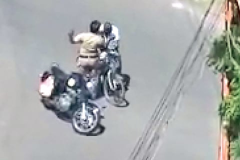 A video grab of a policeman assaulting the old man in Tiruchy that went viral on social media