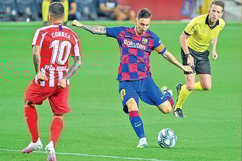 Barcelona talisman Lionel Messi (centre) converted a penalty in the second half