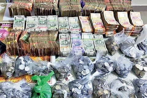 Cash totalling Rs.20.34 lakh seized from accused Maheswari?s (above) house before her arrest