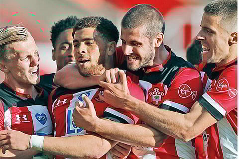 Che Adams celebrates his 1st goal for Southampton with his teammates