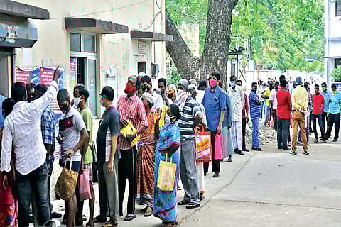 Long queue outside Walajah Road EB office, Chepauk