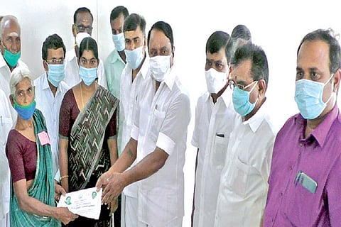 School Education Minister KA Sengottaiyan distributing welfare aid in Erode on Thursday