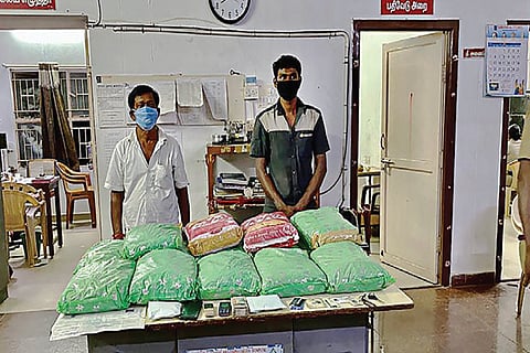 R Ravi and I Sarathkumar, who were arrested by SRMC police, with the ganja they had hoarded