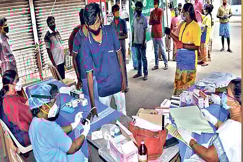 File photo of people being tested for COVID-19 at a fever clinic in Coimbatore