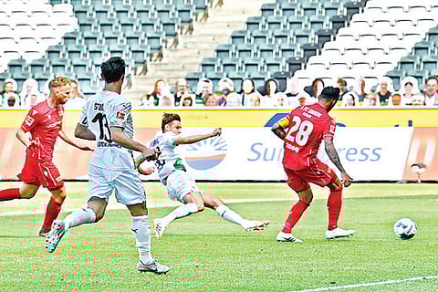 Monchengladbach midfielder Florian Neuhaus scores the opening goal