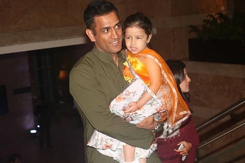 Sakshi captures Dhoni taking Ziva on a bike ride at home