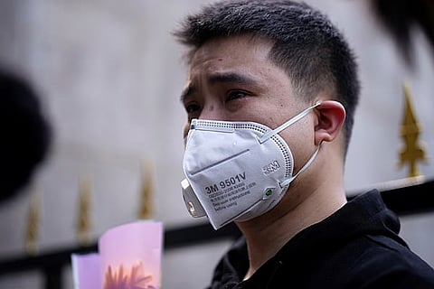 A mourner in Wuhan (Courtesy: Reuters)