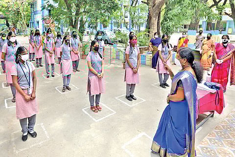 Teachers distribute masks and hall tickets to Class 10 students