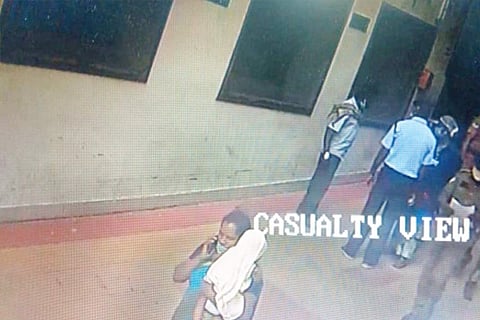 CCTV image shows the woman walking out of the hospital with the baby
