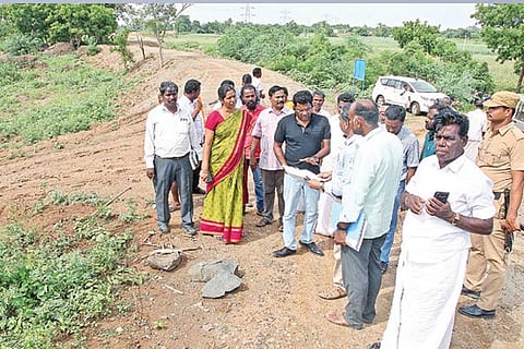 Collector KS Kandasamy (in black T-shirt) inspecting works under 100-day work scheme in Tiruvannamal